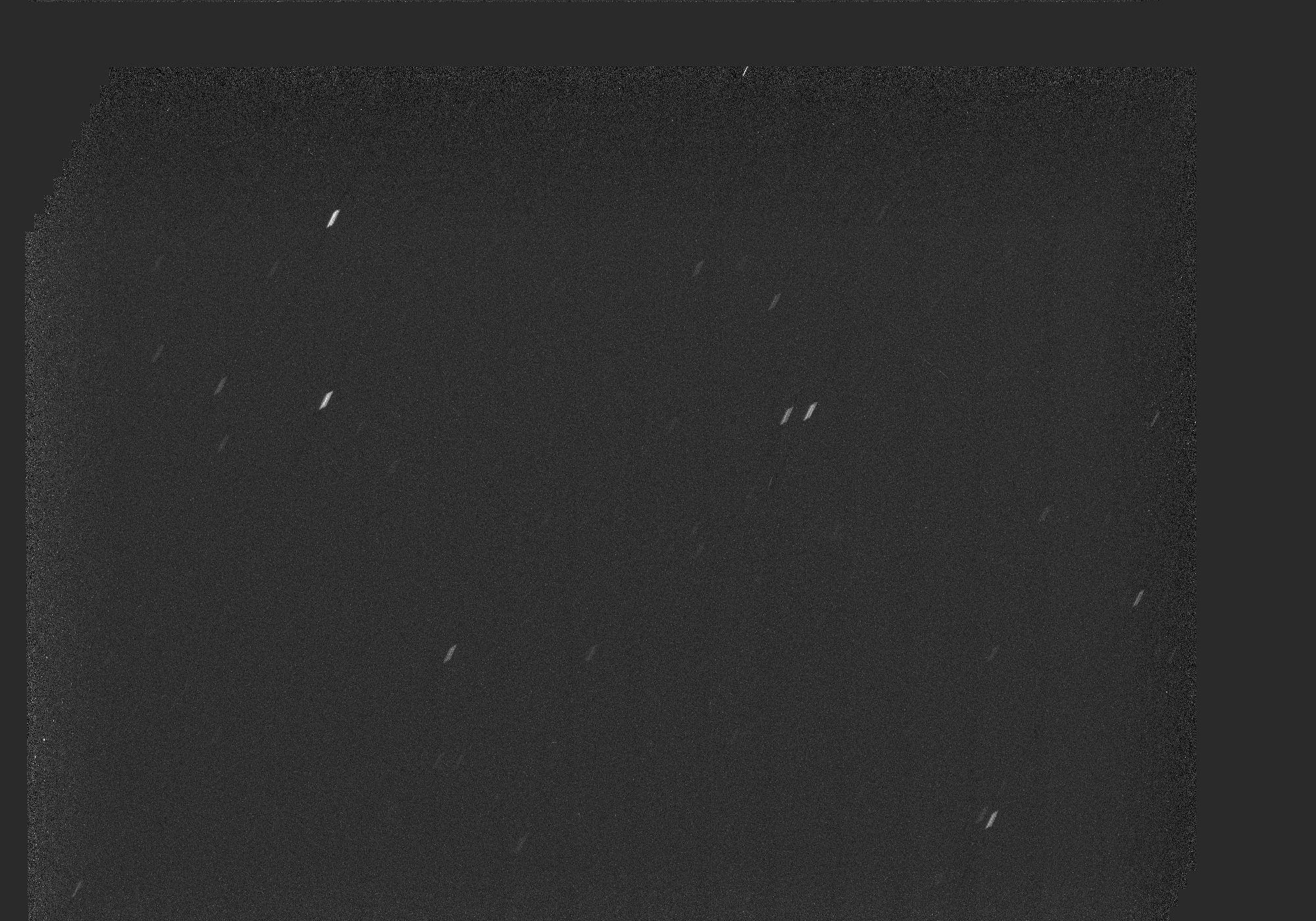 A predominantly black view of space is dotted with stars, seen as short white streaks, in an animated image that consists of two observations. In the right half of the image, interstellar comet 3I/ATLAS is a barely visible white smudge that becomes slightly more distinct in the second observation.